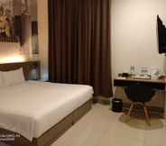 Phòng ngủ 5 Opi Indah Hotel