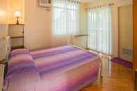 Kamar Tidur Oasi Fiore Bed and Breakfast