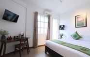 Bedroom 7 Purple Hue - Charming Riverside Hotel