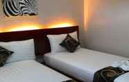 Kamar Tidur 6 Rovic's Tourist Hotel