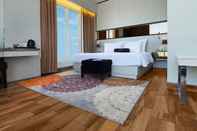 Kamar Tidur Palmy Exclusive Hotel