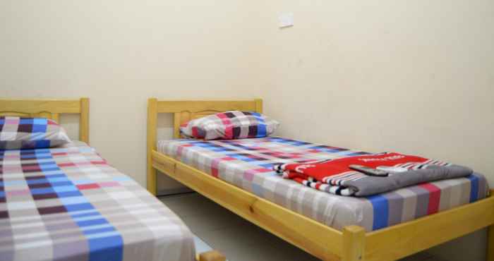 Kamar Tidur Economic Twin Room at D'Kost Homestay Batam (RD2)