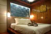 Kamar Tidur Ricci House Resort