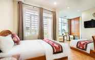 Kamar Tidur 4 Queen Hotel