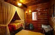 Bedroom 2 Rumah Gadang Natigo "A Home to Stay with Tradition"
