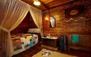Bedroom 7 Rumah Gadang Natigo "A Home to Stay with Tradition"
