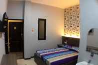 Kamar Tidur Oval Guesthouse