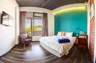 Kamar Tidur Roomies Suites Boutique Hotel