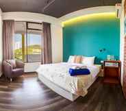 Kamar Tidur 6 Roomies Suites Boutique Hotel