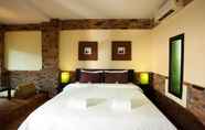 Kamar Tidur 3 Motive Cottage Resort