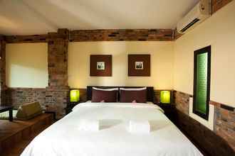 Kamar Tidur 4 Motive Cottage Resort