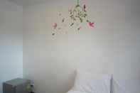 Kamar Tidur White Cat Hotel