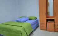 Bedroom 7 Cozy Deluxe Room at Jl Kalimantan by Graha Pastika