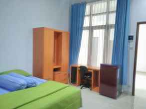 Bedroom 4 Cozy Deluxe Room at Jl Kalimantan by Graha Pastika