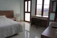 Kamar Tidur Aditya Guest House Syariah