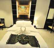 Kamar Tidur 6 The Next Grand Hotel