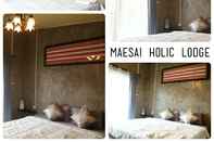 ห้องนอน Maesai Holic Lodge