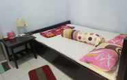 ห้องนอน 2 Cozy Room at Homestay Agbil