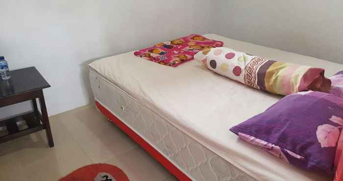 ห้องนอน Cozy Room at Homestay Agbil