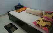 ห้องนอน 6 Cozy Room at Homestay Agbil