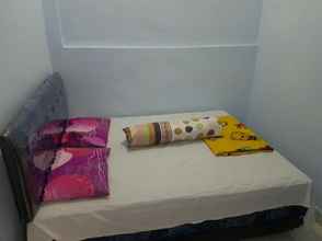 ห้องนอน 4 Cozy Room at Homestay Agbil