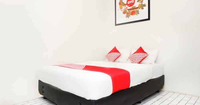 Kamar Tidur OYO 422 Achterhuis Guesthouse