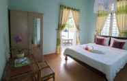 Kamar Tidur 5 Pink Buds Homestay