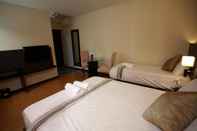 Kamar Tidur Lorenzzo Suites Hotel