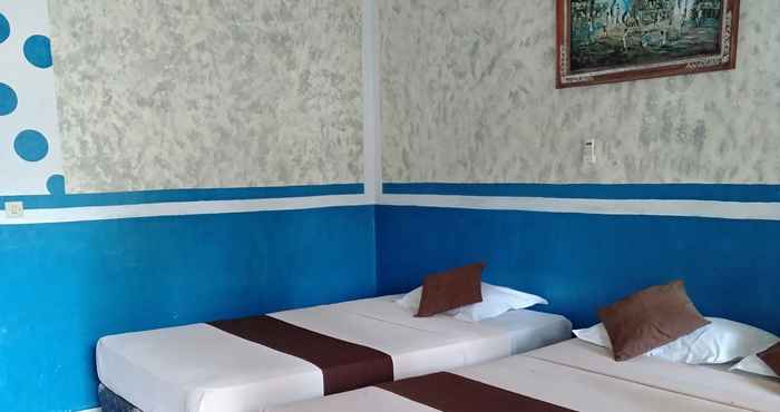 Kamar Tidur Cozy Alfia Inn 