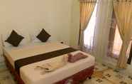 Kamar Tidur 4 Cozy Alfia Inn 