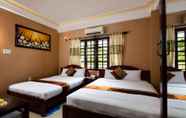 Kamar Tidur 5 Holiday Hotel