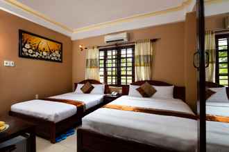 Kamar Tidur 4 Holiday Hotel