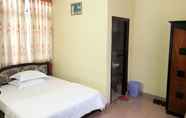 Kamar Tidur 4 Cat Phu Hotel