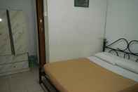 Kamar Tidur Twin Pines Guesthouse