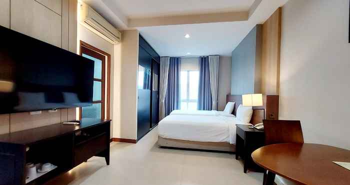 ห้องนอน J. Park Hotel and Serviced Apartment