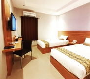 Bedroom 4 Careinn Hotel Merauke