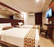 Bedroom 2 Careinn Hotel Merauke