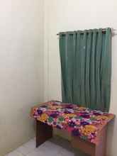 Kamar Tidur 4 Single Room at Rumah Agita Palembang (AGT)