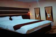 Bedroom Maramba Beach and Resort