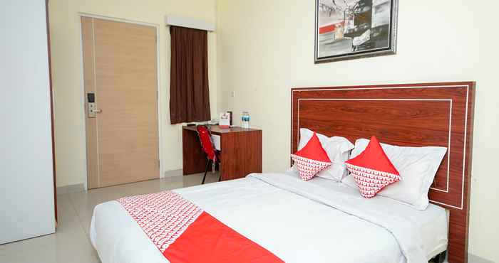 Bedroom OYO 322 Maleo Residence Palembang I