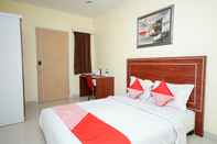 Bedroom OYO 322 Maleo Residence Palembang I