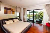 Kamar Tidur Chalong Miracle Lakeview Condo by TropicLook