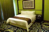 ห้องนอน Mudzaffar Hotel
