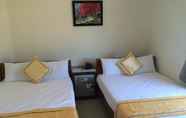 Kamar Tidur 3 Rosa Bay Side Guesthouse