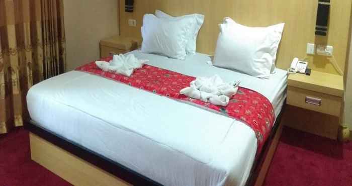 ห้องนอน Hotel Mahavira