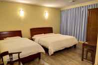 Kamar Tidur Uncle Ho Motel