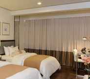 Kamar Tidur 6 The Carmen Hotel