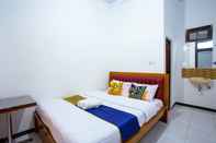 ห้องนอน OYO 2718 Backpacker's Homestay Jlegong