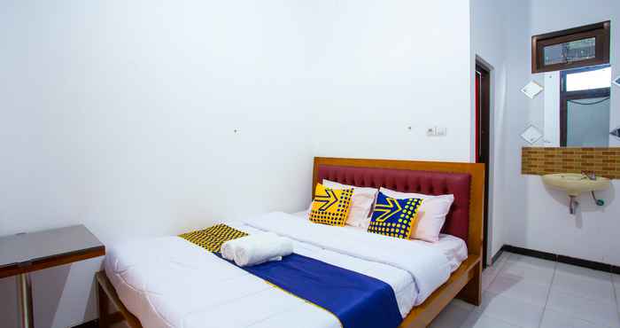 Bedroom OYO 2718 Backpacker's Homestay Jlegong