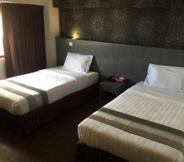 Bedroom 7 Check Inn Hotel Tawau